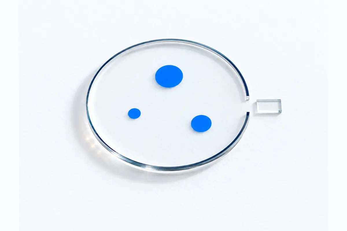 A conceptual scope model: three blue registration points inside a clear circular boundary, with one narrow opening aligned to a single glass record outside.